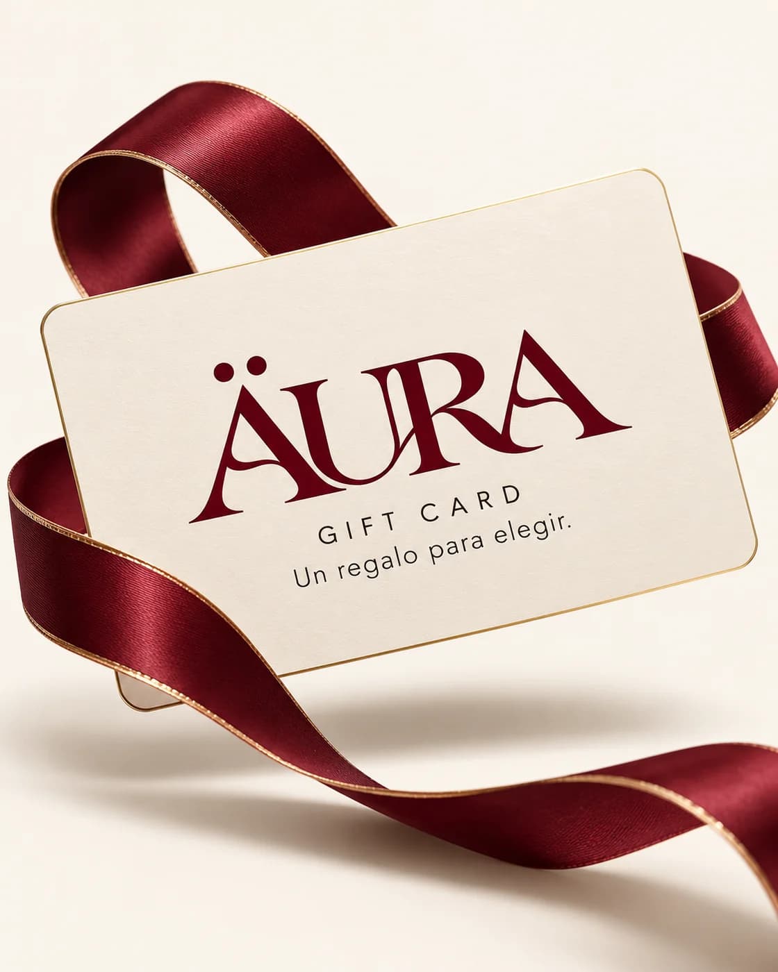 Gift Card Äura: tarjeta marfil con el logo oficial y cinta bordó